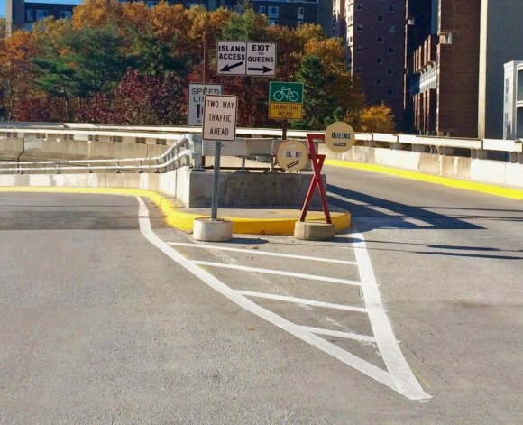 RIOC's Landmark Waste of Taxpayer Money Metal spaghetti makes traffic signs nearly unreadable for drivers, but what we see is a ramp for bikes and cars with a safe 10 mph speed limit. For nothing.